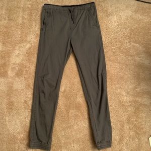Grey straight leg cargo pants w/ cuffed ankles and drawstring waist.